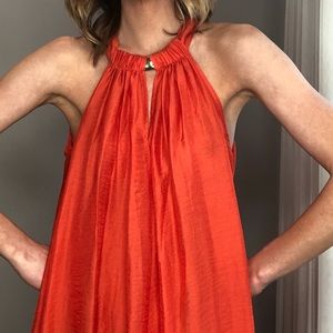 Flowing orange dress with gold detailing